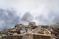 Machu Picchu ruins and mountains in fog Royalty Free Stock Photo