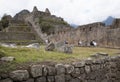 Machu Picchu stone walls and houses perspective with mountains Peru