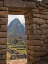 Machu Picchu view of the mountain and the ruins through the doorway