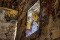 Macka, Trabzon, Turkey - August 3, 2014; Sumela monastery courtyard under the rock. Remains of old fresco are seen on several