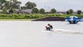 Adult Helps Child To Kneeboard