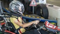 A Child Driving a Go-Kart Circuit