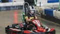 A Child Driving a Go-Kart Circuit