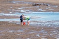 A Couple Pumping For Bait To Go Fishing