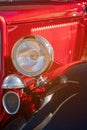 Close Up Of Headlamp Of Red Classic Car Royalty Free Stock Photo