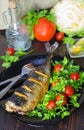 Mackerel baked with lemon. Fish on a plate with vegetables Royalty Free Stock Photo