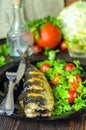 Mackerel baked with lemon. Fish on a plate with vegetables Royalty Free Stock Photo