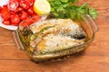 Mackerel baked with lemon and sesame in glass baking pan Royalty Free Stock Photo