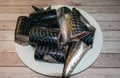 Mackerel cut into pieces, placed on a plate. Royalty Free Stock Photo