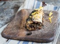 Mackerel fish on a wooden board and an old towel Royalty Free Stock Photo