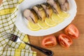 Mackerel, slices of lemon in dish, tomatoes, napkin Royalty Free Stock Photo