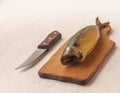 Mackerel smoked chopped to pieces on a cutting board Royalty Free Stock Photo
