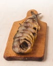 Mackerel smoked chopped to pieces on a cutting board Royalty Free Stock Photo