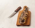 Mackerel smoked chopped to pieces on a cutting board Royalty Free Stock Photo
