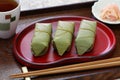 Mackerel sushi wrapped by persimmon leaf; japanese food