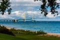 The Mackinac Bridge framed with trees on a summer day. Royalty Free Stock Photo