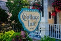 Mackinaw Island, MI - July 14, 2021: Digitally created watercolor painting of Cottage Inn of Mackinac sign Royalty Free Stock Photo