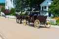 Mackinaw Island, MI - July 14, 2021: Horse drawn carriage on Mackinac Island, MI on July 14, 2021. Royalty Free Stock Photo