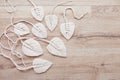 Macrame leaves in natural color on the wooden background. Cotton rope decor macrame to make your home more cozy and unique. Woman