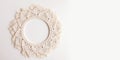 Macrame mandala. Macrame wreath on a white background close up. Natural cotton thread. Eco home decor. Banner. Copy space