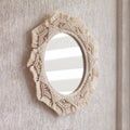 Macrame mirror on a white wall. Eco-style. Natural materials. Soft fokus