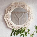 Macrame mirror on a white wall. The mirror reflects macrame wallhanging. Eco-style. Natural materials. Soft fokus