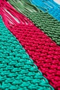 Macrame technique, a square knot of multi-colored threads.