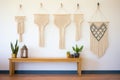 macrame wall hangings displayed in a row