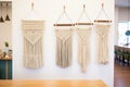 macrame wall hangings displayed in a row