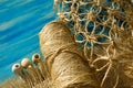 Macrame weaving from straw on a turquoise background