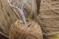 MacramÃÂ© still life detail of rope texture - group of cords and threads with scissors to handcraft macrame home decoration in