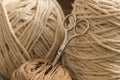 MacramÃÂ© still life detail of rope texture - group of cords and threads with scissors to handcraft macrame home decoration in