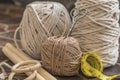 MacramÃÂ© still life - group of cords and threads with scissors and measure tape including wood elements to handcraft macrame home