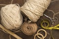 MacramÃÂ© still life - group of cords and threads with scissors and measure tape including wood elements to handcraft macrame home