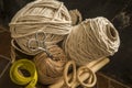 MacramÃÂ© still life - group of cords and threads with scissors and measure tape including wood elements to handcraft macrame home