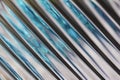 Macro abstract background of beautiful diagonal cut lead crystal glass texture reflecting blue and silver color