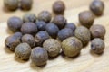 Macro allspice on wooden background Royalty Free Stock Photo