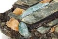 Macro aquamarine mineral stone in rock on white background