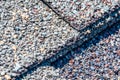 Macro of asphalt shingle layered seam on a residential house.