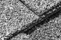 Macro of asphalt shingle layered seam on a residential house.