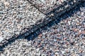 Macro of asphalt shingle layered seam on a residential house.