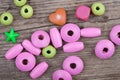 Macro backdrop of little toy beads on wooden background