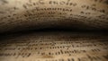 Macro background of saved medieval book with ancient writings.Archival artifacts