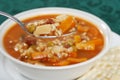 Macro beef barley soup in a spoon Royalty Free Stock Photo