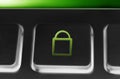 Macro Of A Black Button With Green Closed Security Lock Icon