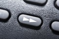 Macro Of A Black Fast Forward Button On Black Remote Control For A Hifi Stereo Audio System