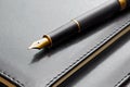 Black luxury gold plated fountain pen on leather notebook cover Royalty Free Stock Photo