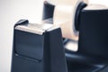 Macro Of A Black Sellotape Holder On A White Office Desk