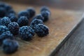 Macro of a blackberry on a wooden background. Royalty Free Stock Photo
