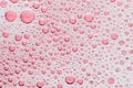 Macro bubble of pink water background, transparent bath soap